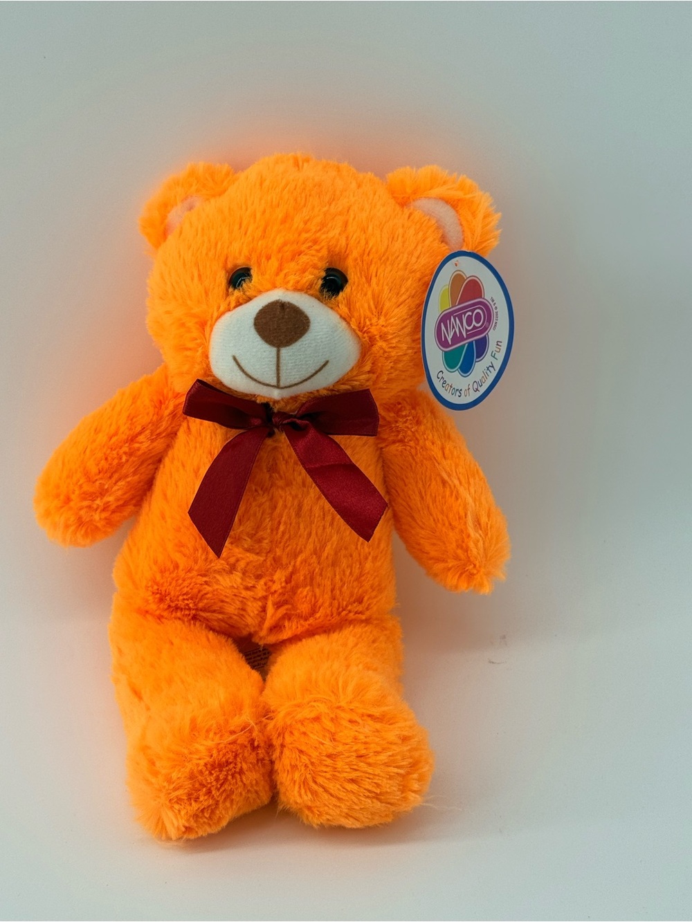 Wakoo Orange Plush Teddy Bear with Burgundy Bow